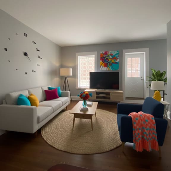 a living room with a white couch, a blue chair, and a wooden coffee table.