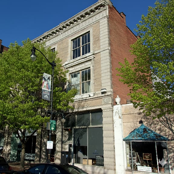 a street view of a building with a sign that says "consult".