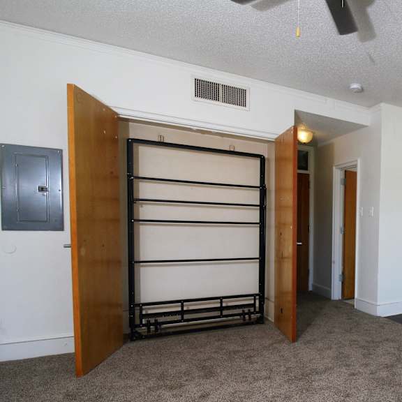 a kitchen with a refrigerator freezer next to a stove top oven