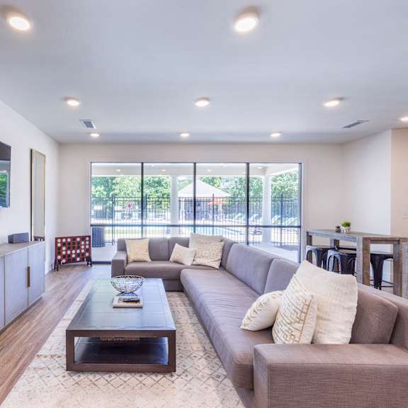 a living room with a couch and a coffee table at aventura at towne centre, missouri, 63011