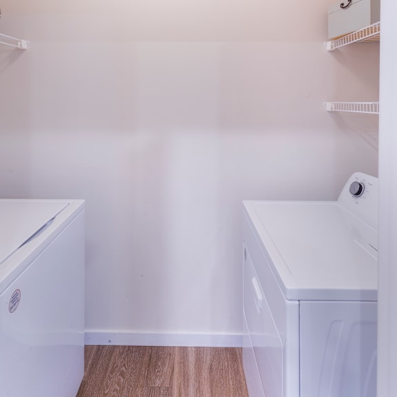 a washer and dryer in a room with white walls at aventura at towne centre, ellisville, mo, 63011