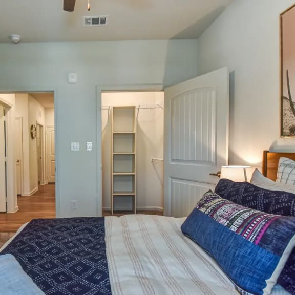 Thumbnail 10 of 11 Bedroom with dual closets and hardwood flooring 1 at High Point Preserve Apartments, Austin