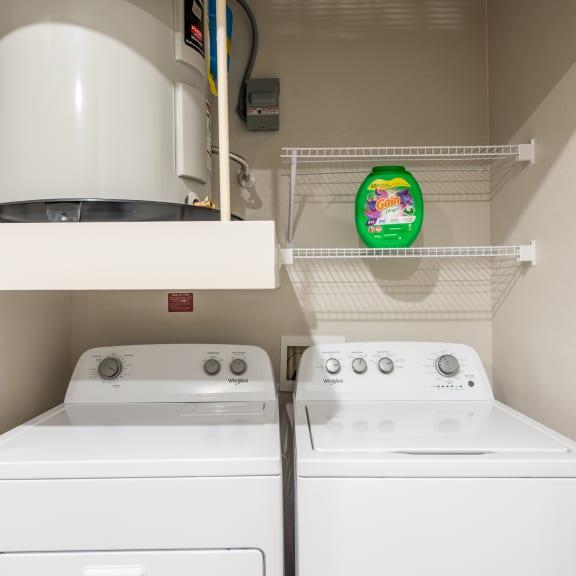 Thumbnail 15 of 15 the laundry room has two washers and a dryer at Three Hills, Austin, TX 78747