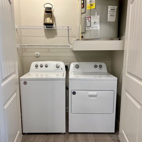 Thumbnail 9 of 13 Laundry closet with white washer and dryer 2 at High Point Preserve Apartments, Austin, TX 78724