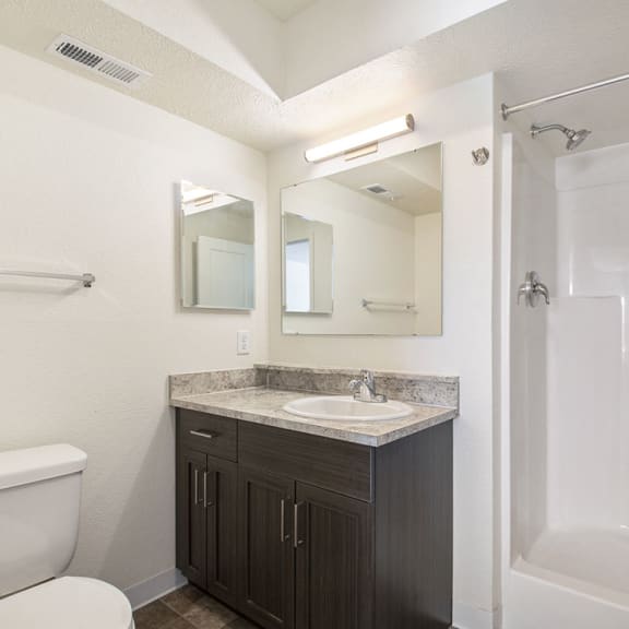 Thumbnail 10 of 10 second bathroom with a walk in shower bedroom with ceiling fan at Andover Pointe Apartment Homes, La Vista