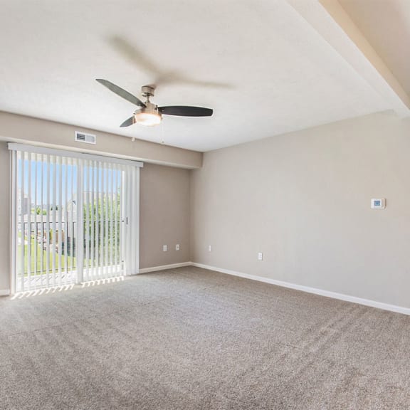 Thumbnail 3 of 10 living room with 9' ceiling and a ceiling fan  at Andover Pointe Apartment Homes, Nebraska