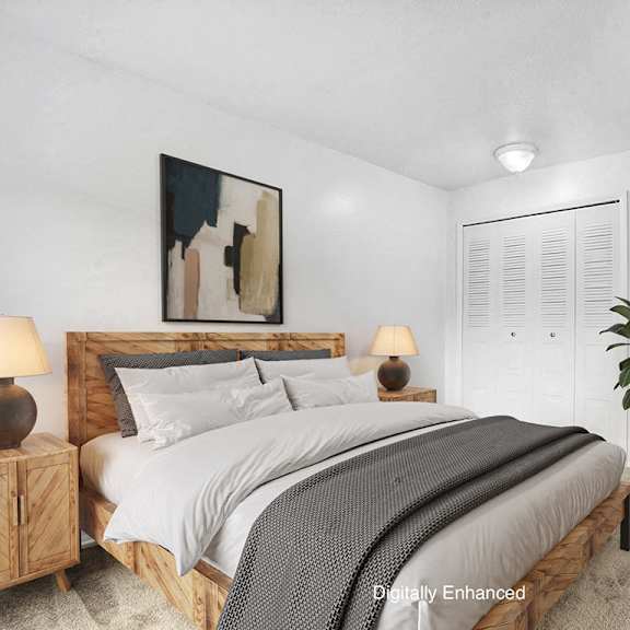 Thumbnail 8 of 8 A bedroom with a large bed and closet  at Apple Ridge Apartments, Walker, MI