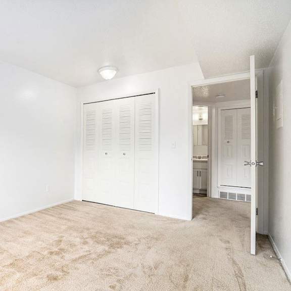 Thumbnail 7 of 7 A bedroom with a large closet at Apple Ridge Apartments, Walker, MI, 49534