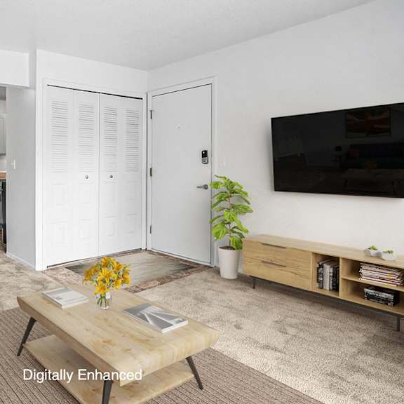 Thumbnail 4 of 8 A living and dining room with plush carpeting at Apple Ridge Apartments, Walker, MI