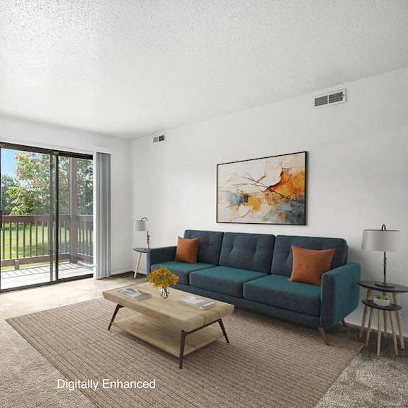 Thumbnail 3 of 8 a living room with a couch and a slider to a balcony at Apple Ridge Apartments, Walker, MI