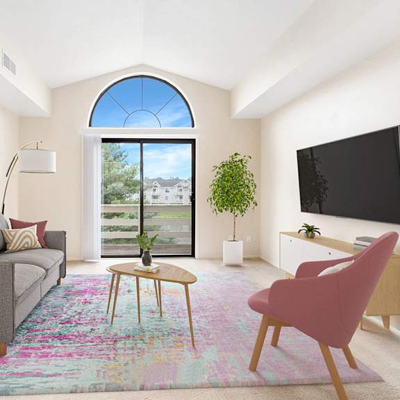 Thumbnail 3 of 9 A living room with a cathedral ceiling and a grey couch at Arbor Lakes Apartments in Elkhart, IN