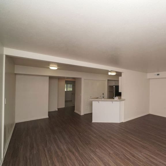 Thumbnail 4 of 8 an empty living room and kitchen in an empty house at Arbor Lakes Apartments in Elkhart, IN