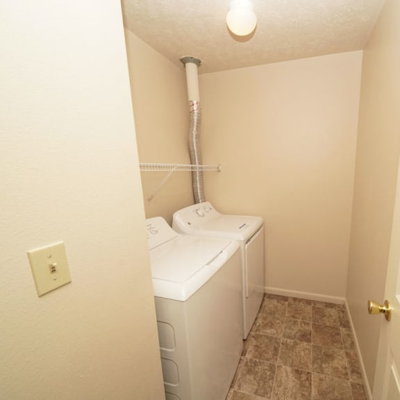 Thumbnail 7 of 13 a small bathroom with a washer and dryer in it at Autumn Lakes Apartments and Townhomes, Mishawaka, IN