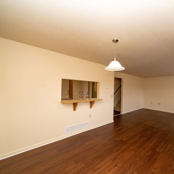Thumbnail 4 of 14 an empty living room with a hard wood floor at Autumn Lakes Apartments and Townhomes, Mishawaka, Indiana