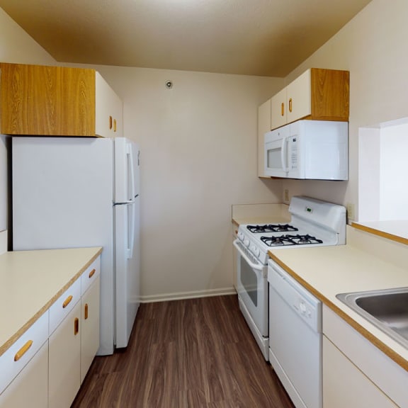 Thumbnail 6 of 15 a townhome kitchen with built in microwave at Autumn Lakes Apartments and Townhomes, Indiana