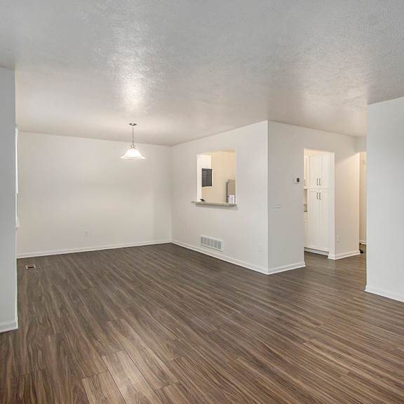 Thumbnail 4 of 16 A dining room with vinyl plank flooring and a breakfast bar at Autumn Lakes Apartments and Townhomes, Mishawaka, 46544