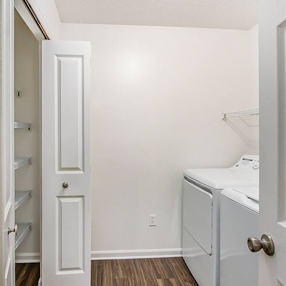 Thumbnail 7 of 16 A laundry room with a washer and dryer and a closet at Autumn Lakes Apartments and Townhomes, Mishawaka, 46544