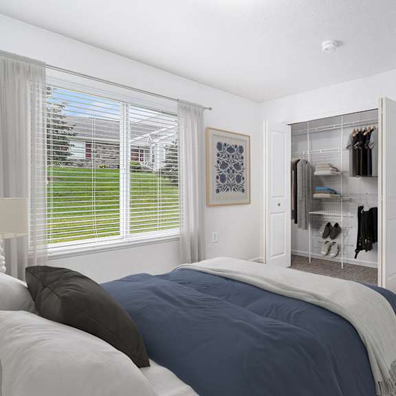 Thumbnail 8 of 12 A bedroom with a carpeted floor and a window with blinds at Autumn Lakes Apartments and Townhomes, Mishawaka, 46544