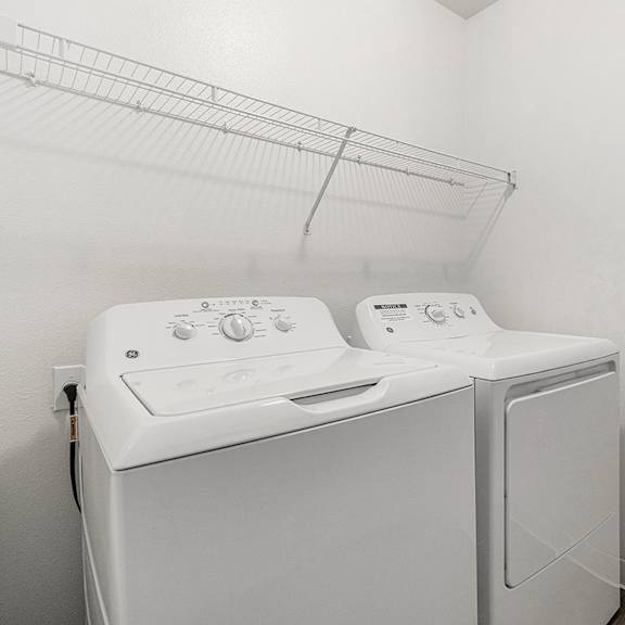 Thumbnail 6 of 12 A laundry room with a full-size washer and dryer at Autumn Lakes Apartments and Townhomes, Mishawaka, 46544