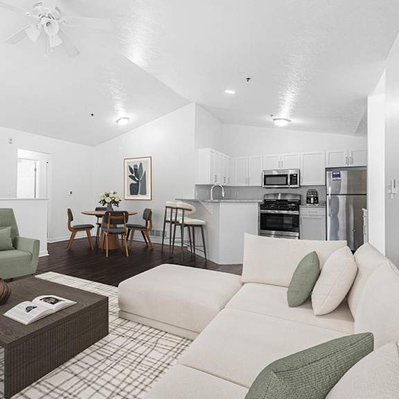 Thumbnail 3 of 12 A large living room with vinyl plank flooring and a kitchen area in the background at Autumn Lakes Apartments and Townhomes, Mishawaka, 46544