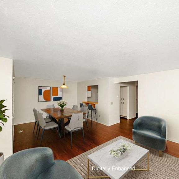 Thumbnail 4 of 15 A living room and dining room with hard surface flooring at Autumn Lakes Apartments and Townhomes, Indiana