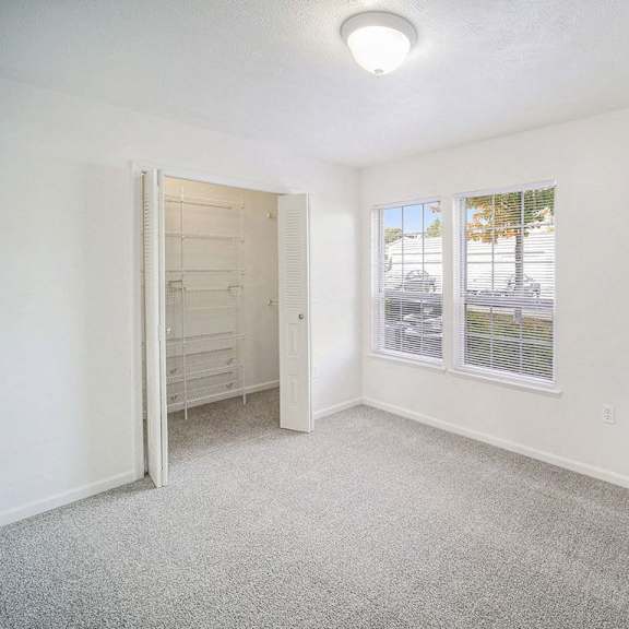 Thumbnail 10 of 10 spacious bedroom with large windows and a walk in closet at Black Sand Apartment Homes in Lincoln, NE