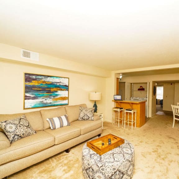 Thumbnail 4 of 14 a living room with a couch and a table at Brentwood Park Apartments, La Vista, 68128