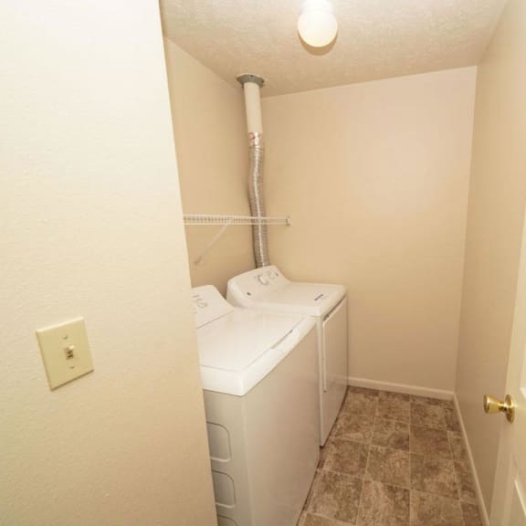 Thumbnail 9 of 16 a  laundry room with a washer and dryer in it at Brentwood Park Apartments, La Vista, 68128