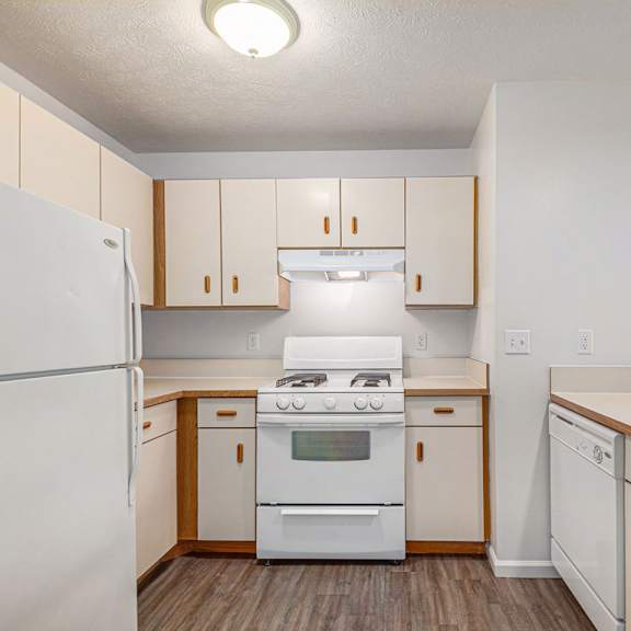 Thumbnail 8 of 20 A kitchen with a breakfast bar at Brentwood Park Apartments in LaVista, NE