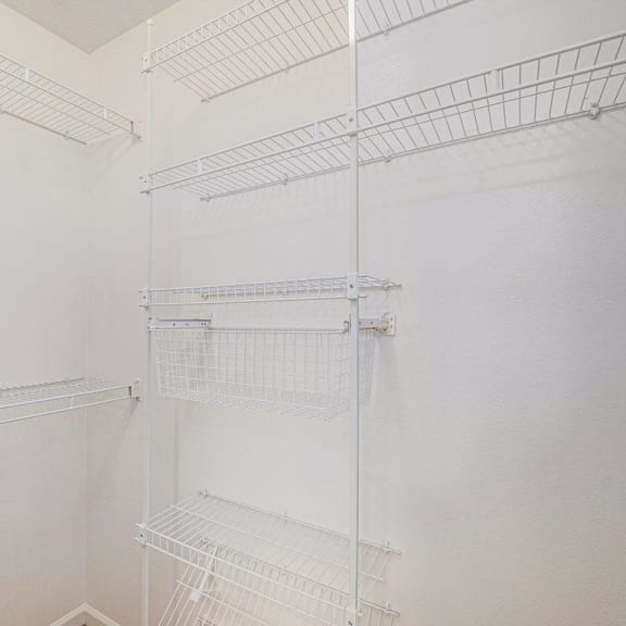 Thumbnail 8 of 12 walk in closet with white shelves  at Black Sand Apartment Homes, Nebraska, 68504