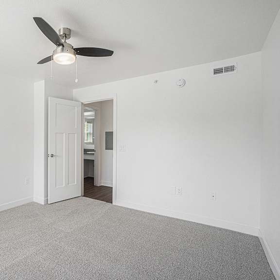 Thumbnail 14 of 14 A spacious bedroom with a walk in closet at Byron Lakes Apartments, Byron Center, MI