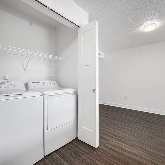 Thumbnail 14 of 19 a washer and dryer at Byron Lakes Apartments in Byron Center, MI
