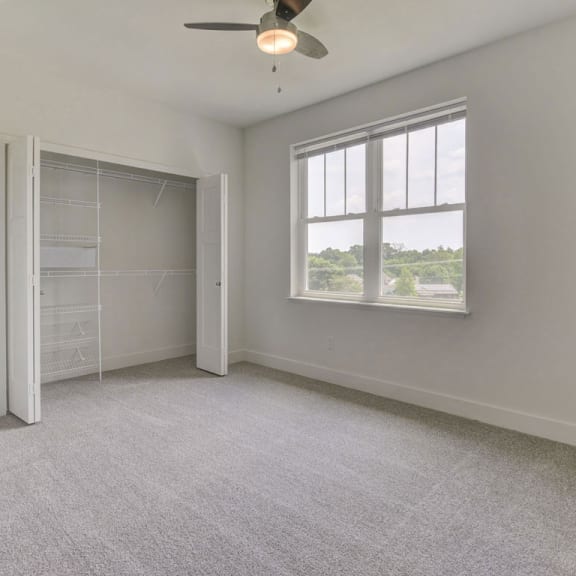 Thumbnail 18 of 18 A spacious bedroom with a closet with organizers at Chase Creek Apartment Homes, Huntsville, 35811