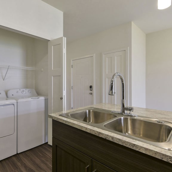 Thumbnail 11 of 18 A full size washer and dryer at Chase Creek Apartment Homes, Huntsville