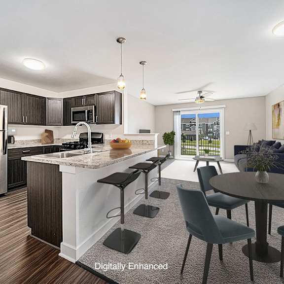 Thumbnail 3 of 18 A modern kitchen with a dining table set for four at Chase Creek Apartment Homes, Huntsville, 35811