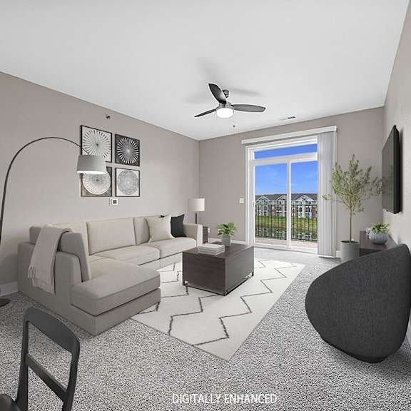 Thumbnail 3 of 12 A modern living room with a grey sofa, a black chair, and a television