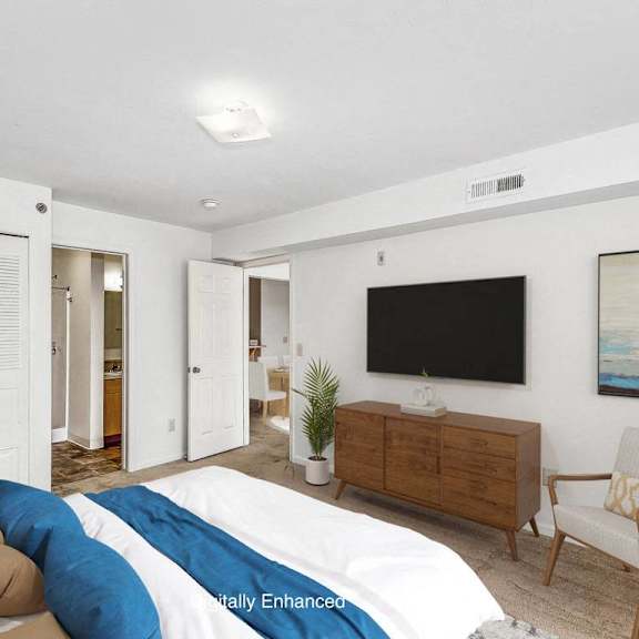 Thumbnail 10 of 11 A primary bedroom with a bed, walk in closet and attached bath with shower at Colonial Pointe at Fairview Apartments, Nebraska