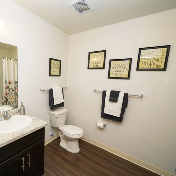 Thumbnail 13 of 15 A bathroom with hard surface flooring at Copper Creek Apartment Homes, Maize, 67101
