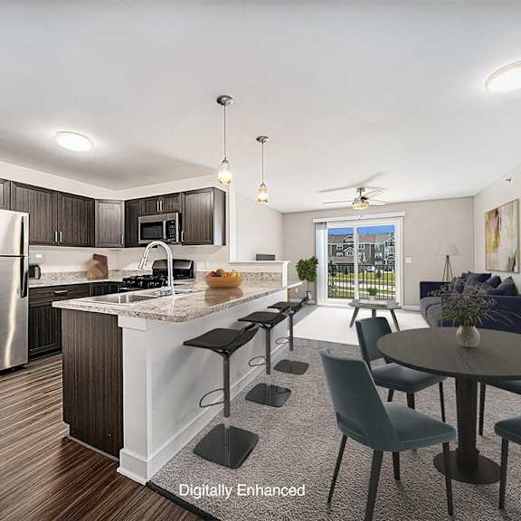 Thumbnail 3 of 15 A kitchen with a refrigerator, a breakfast bar, and a dining table at Copper Creek Apartment Homes, Kansas, 67101