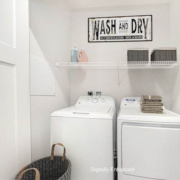 Thumbnail 11 of 15 A laundry area with a full size washer and dryer at Copper Creek Apartment Homes, Kansas, 67101