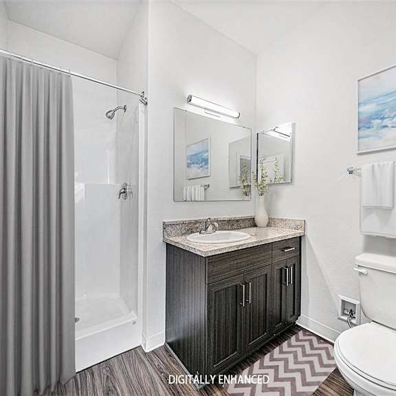 Thumbnail 14 of 14 A 2nd bathroom with a sink, toilet, and shower at Copper Creek Apartment Homes, Maize, Kansas