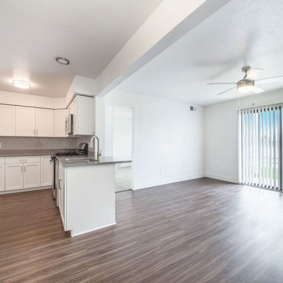 Thumbnail 3 of 10 Living room and kitchen at The Crossings Apartments, Grand Rapids, 49508