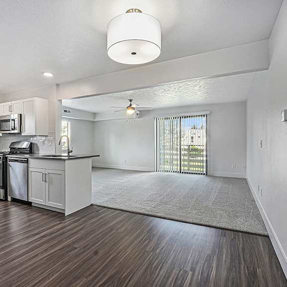 Thumbnail 4 of 13 A kitchen with white cabinets at The Crossings Apartments in Grand Rapids, MI