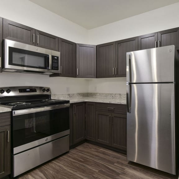 Thumbnail 6 of 14 A kitchen with a pantry at Dodson Pointe Apartment Homes, Arkansas