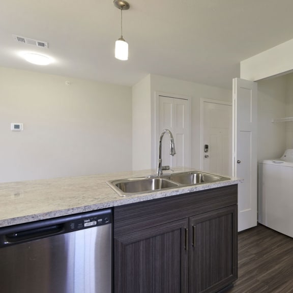Thumbnail 8 of 12 A full size washer and dryer at Dodson Pointe Apartment Homes, Rogers, Arkansas