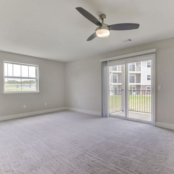 Thumbnail 4 of 12 Enlarged living room with an extra window at Dodson Pointe Apartment Homes, Arkansas, 72758