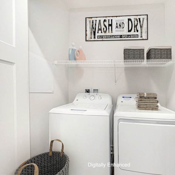 Thumbnail 8 of 14 A full size washer and dryer at Dodson Pointe Apartment Homes, Rogers