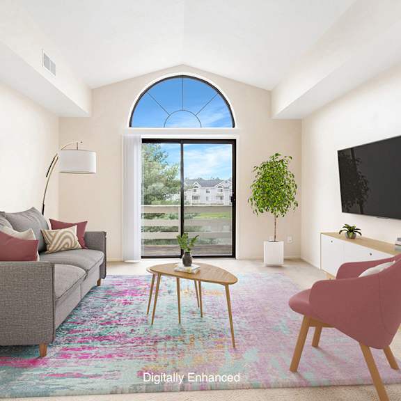 Thumbnail 3 of 9 A living room with a grey couch, a pink chair, a small table, a flat screen TV, and a large window with a view at Dupont Lakes Apartments, Fort Wayne