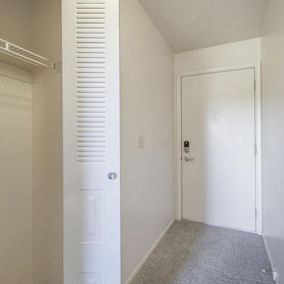 Thumbnail 5 of 16 A white closet near the front door at Dupont Lakes Apartments in Fort Wayne, IN