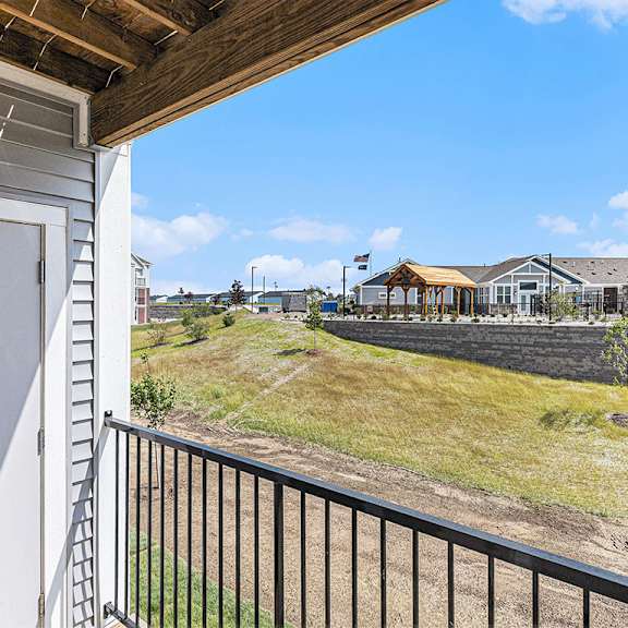 Thumbnail 5 of 18 A patio/balcony with a view at Eagle Ridge Apartment Homes, Traverse City, MI 49685